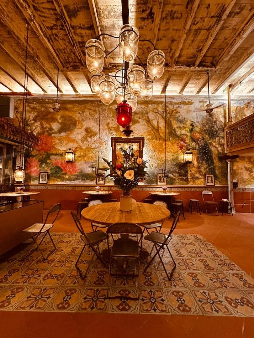 The vintage shop room at IHCC, filled with collected treasures beneath a chandelier